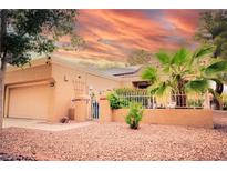 Charming single-story home featuring desert landscaping and a private courtyard entrance at 9000 Litchfield Ave, Las Vegas, NV 89134