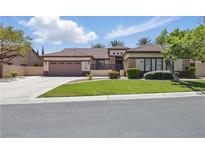 Charming single-story home with a well-manicured lawn, desert landscaping, and a two-car garage at 10089 Clifton Forge Ave, Las Vegas, NV 89148