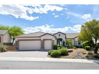Charming single-story home with desert landscaping, three-car garage, and tile roof at 1613 Williamsport St, Henderson, NV 89052