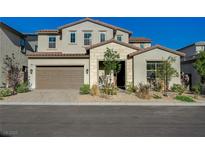 Charming two-story home showcasing a desert-landscaped front yard and a two-car garage at 168 Robledo St, Las Vegas, NV 89138