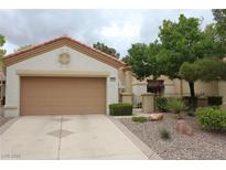 Charming single-story home with a two-car garage and well-maintained landscaping at 2013 Capestone St, Las Vegas, NV 89134