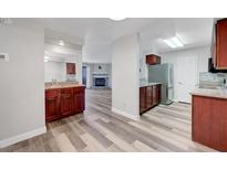 Bright kitchen with stainless steel appliances and wood cabinets, offering ample storage and modern convenience at 2451 N Rainbow Blvd # 2144, Las Vegas, NV 89108