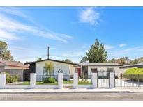 Charming single-story home with well-maintained landscaping and secure gated entrance at 3805 San Angelo Ave, Las Vegas, NV 89102