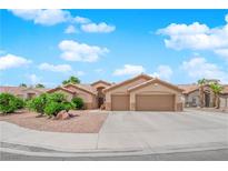 Charming single-story home featuring a two-car garage, desert landscaping, and a well-maintained facade at 5433 Escallonia St, Las Vegas, NV 89149