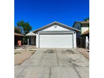 Charming single-story home with a large two-car garage, clear blue skies, and easy parking at 5436 Burkshire Dr, Las Vegas, NV 89142