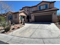 Charming two-story home featuring a spacious driveway and well-maintained landscaping at 10025 Central Valley Ave, Las Vegas, NV 89149