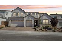 Beautiful two-story home featuring a brick driveway, three-car garage, modern design and well-manicured landscaping at 10196 Sequoia Glen Ave, Las Vegas, NV 89166
