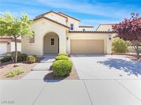 Charming two-story home with a well-manicured lawn, desert landscaping, and a welcoming entrance at 10331 Northern Hills Ave, Las Vegas, NV 89166