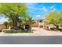 Stunning two-story home boasting desert landscaping, mature trees, and a three-car garage at 11237 Campsie Fells Ct, Las Vegas, NV 89141