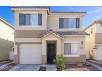 Charming two-story home features a well-maintained lawn and a welcoming front entrance with attached garage at 2272 Platinum Band St, Las Vegas, NV 89156