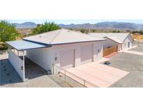 Detached garage with two parking spaces, side carport and mountain views at 2650 Sagebrush Ave, Pahrump, NV 89048