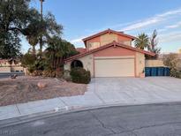 Charming two-story home featuring a wide driveway, desert landscaping, and a spacious two-car garage at 4066 Aduana Ct, Las Vegas, NV 89103