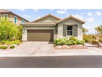 Charming single-story home featuring a two-car garage and well-maintained landscaping at 5530 Hill Spire St, Las Vegas, NV 89166