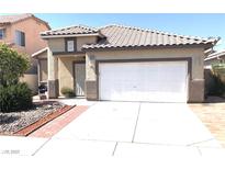 Charming home featuring a two-car garage, well-maintained yard, and appealing exterior at 6030 Halehaven Dr, Las Vegas, NV 89110