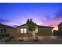 Charming single story home with desert landscaping, brick driveway, and a two car garage in a suburban neighborhood at 7070 Cinder Horse St, Las Vegas, NV 89131