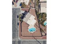 Aerial view of property showcasing a refreshing pool, set on a spacious lot in a desirable neighborhood at 10290 Marion Morrison Ct, Las Vegas, NV 89183