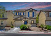 Charming two-story home with blue shutters, a well-manicured lawn, and a two-car garage at 11919 Jersey Lilly St, Las Vegas, NV 89183