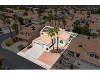 Charming single Gathering home featuring desert landscaping, attached garage and private pool at 2024 Spruce Brook Dr, Henderson, NV 89074