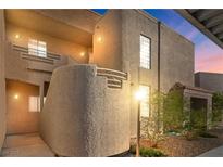 This exterior view displays a unique stucco building with a well-kept landscape at 2191 Bay Club Dr # 204, Laughlin, NV 89029