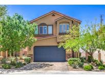 Charming two-story home featuring a landscaped front yard and a two-car garage at 2293 Sky Island Dr, Henderson, NV 89002