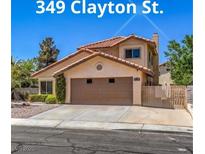 Charming home featuring a well-maintained yard, neutral tones, and a two-car garage at 349 Clayton St, Henderson, NV 89074