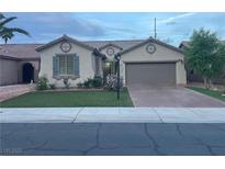 Charming single-story home with a well-manicured lawn and an attached two-car garage in a quiet neighborhood at 3562 Driving Range St, Las Vegas, NV 89122