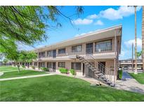 Charming apartment building featuring well-maintained lawns and a stairway leading to the second floor entrance at 3727 Hazelwood St # 12, Las Vegas, NV 89119