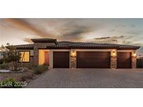 Beautiful single-story home with stone accents, three-car garage, and desert landscaping at 5741 N Park St, Las Vegas, NV 89149
