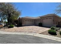 Charming one-story home with a three-car garage and a well-maintained front yard at 8777 Beckett Ridge Ave, Las Vegas, NV 89149