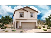 Charming two-story home featuring neutral stucco, tan accents, a two-car garage and desert landscaping at 1006 Smiths Island Ave, North Las Vegas, NV 89084