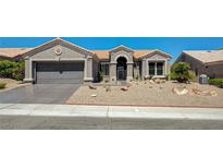 Charming single-story home with a well-maintained front yard and two-car garage at 2625 Youngdale Dr, Las Vegas, NV 89134
