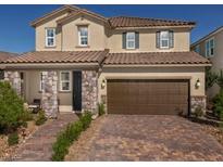 Charming two-story home featuring a stone-accented facade and a spacious two-car garage at 3426 Oristano Ln, Henderson, NV 89044