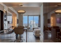 Modern condo kitchen with stainless steel appliances and sleek finishes, open to living area with city views at 4381 W Flamingo Rd # 3818, Las Vegas, NV 89103
