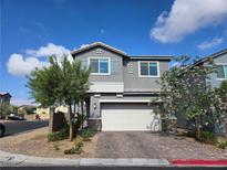 Charming two-story home with a well-manicured yard and a spacious two-car garage at 5817 Bonita Rose St, Las Vegas, NV 89113