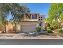 Charming two-story home featuring a neutral color palette, tile roof, attached garage, and tidy front yard at 756 Arden Valley Ave, Henderson, NV 89011