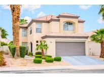 Charming two-story home featuring desert landscaping and a two-car garage at 7840 Millhopper Ave, Las Vegas, NV 89128