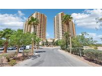 Beautiful view of the condominium towers, green landscaping and entry road at 8255 Las Vegas Blvd # 713, Las Vegas, NV 89123