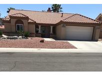 Charming single-story home with a well-maintained front yard and two-car garage at 8901 Kingsmill Dr, Las Vegas, NV 89134