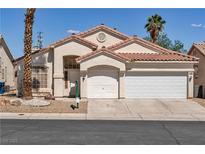 Charming single-story home featuring a two-car garage and low-maintenance desert landscaping at 8940 Emery Lake St, Las Vegas, NV 89123