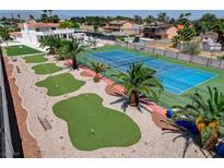 Expansive backyard featuring a tennis court and putting green, perfect for outdoor activities and entertaining at , Las Vegas, NV 89146