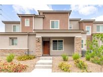 Charming two-story home with desert landscaping and stone accents on the front exterior at 10777 Briset Ct, Las Vegas, NV 89166