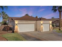 Charming home featuring a well-maintained front yard and a two-car garage, enhancing curb appeal at 1223 Golf Club Dr, Laughlin, NV 89029