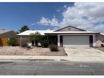 Single-story home featuring an attached garage and desert landscaping at 204 Bradshaw Way, Las Vegas, NV 89145