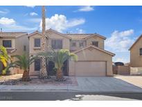Charming two-story home boasts desert landscaping and an attached two-car garage at 227 Palmarosa St, Henderson, NV 89015