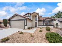 Charming single-Gathering home with a two-car garage and desert landscaping for low maintenance at 389 Umbria Way, Henderson, NV 89014