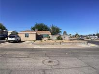 Charming single-story home with well-maintained landscaping and a brick accent wall at 400 National St, Henderson, NV 89015
