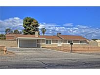 Charming single-story home featuring a carport, low brick wall, and desert-friendly landscaping at 4211 Bradley Rd, Las Vegas, NV 89130
