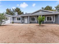 Charming single-story home with gravel landscaping and a light gray exterior paint at 4620 Pacer Ave, North Las Vegas, NV 89031