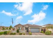 Beautiful single-story home featuring stone accents, a tile roof, a two-car garage, and low-maintenance landscaping at 8257 Skye Peak St, Las Vegas, NV 89166