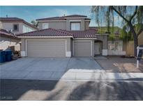 Charming two-story home featuring a three-car garage and a well-maintained front yard at 8355 Cabin Peak St, Las Vegas, NV 89123